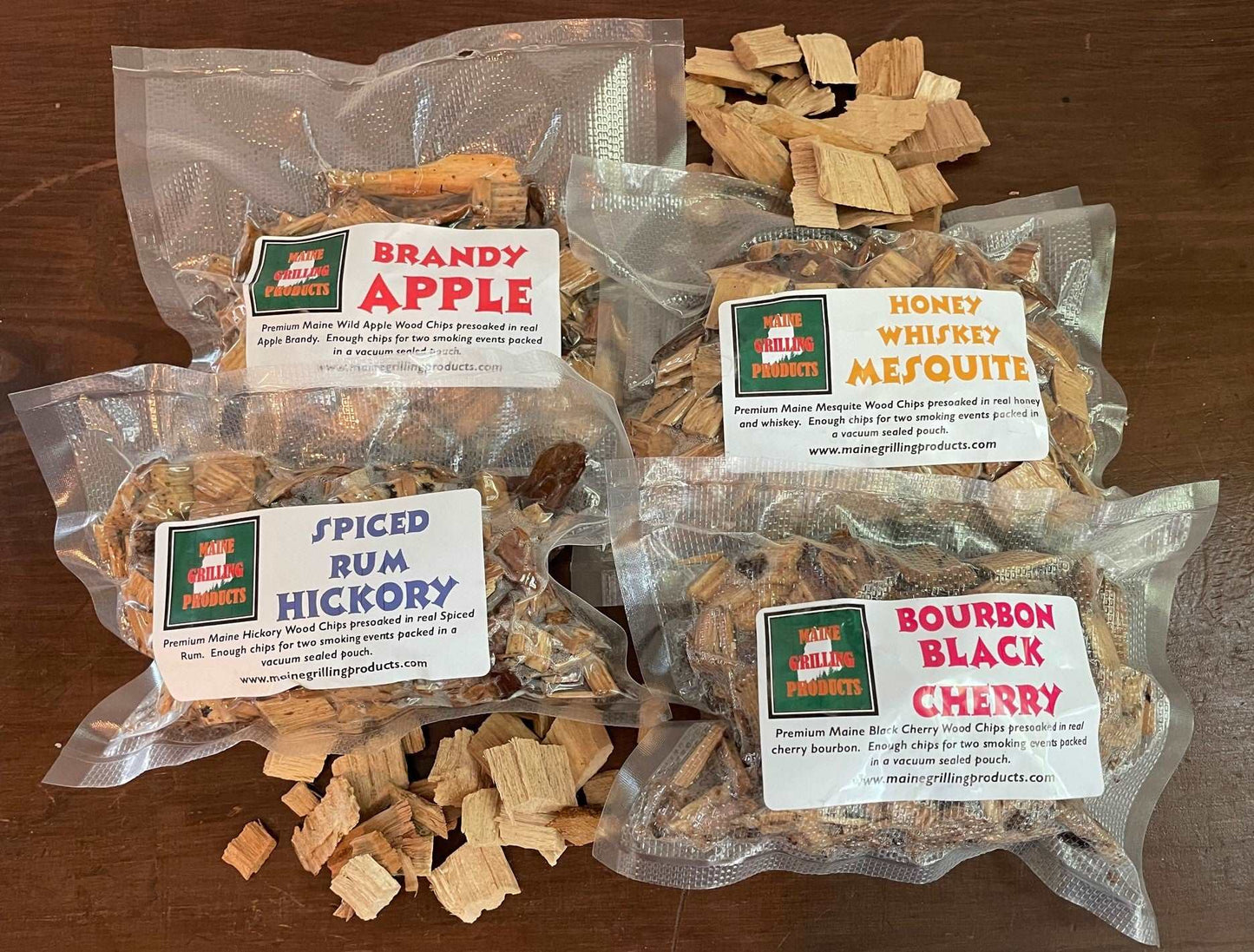 PRE-SOAKED FLAVORED MAINE WOOD CHIPS VARIETY PACK (ONE EACH 6 OZ POUCH) BRANDY APPLE, HONEY WHISKEY MESQUITE, SPICED RUM HICKORY, AND BOURBON BLACK CHERRY